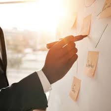 Person with napkin held to face, appearing sad and withdrawn, representing depression.